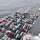 Image for article titled Why Is This Supercarrier's Deck Packed With Cars In the Middle of the Pacific?